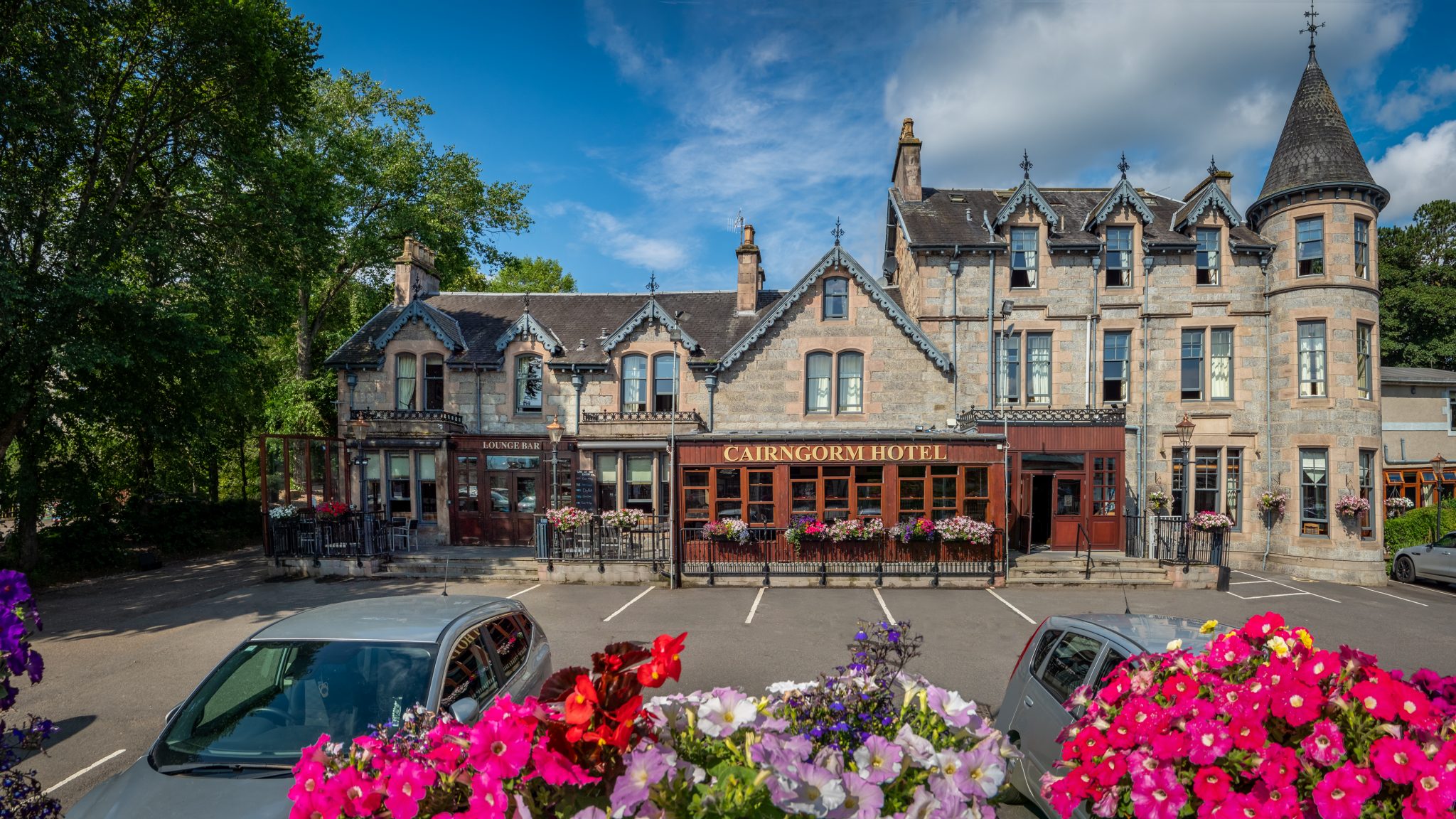 cairngorm hotel with flowers in foreground