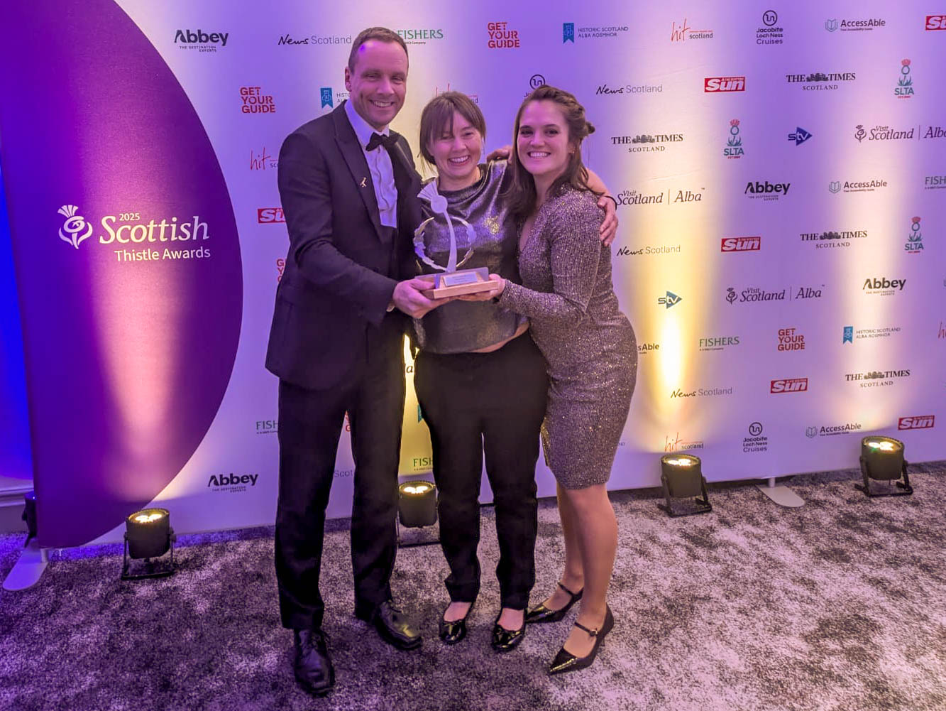 Ben Supple, Lucy Petrie Jess Wise with the Best Visitor Attraction award at the Scottish Thistle Awards 2025 IMAGE RZSS 2025