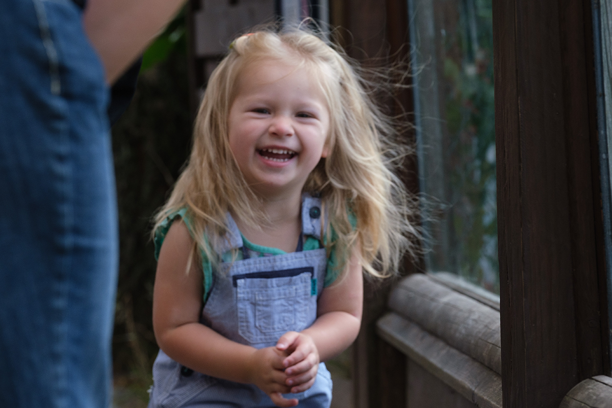 Young girl laughing into camera IMAGE: Robin Mair 2022